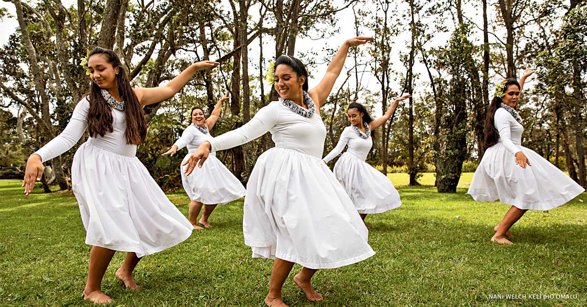 Dancers from Hālau Nāwehiokaipoaloha performing hula Koaʻe near Volcano Art Center.