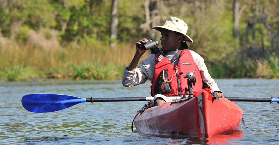 kayaker with binoculars