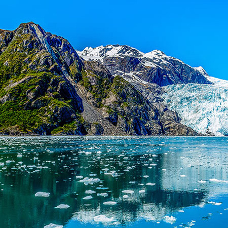 Melting ice with mountains in the background