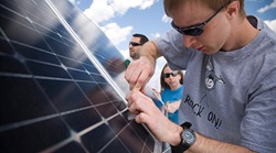 college student working on solar panel