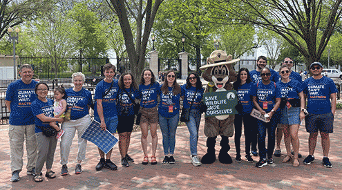 Ranger Rick with group of people at climate rally.