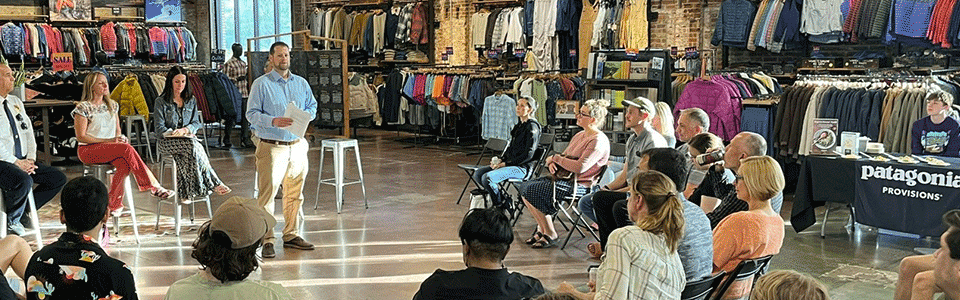 People gathered to listen to speaker in Patagonia store