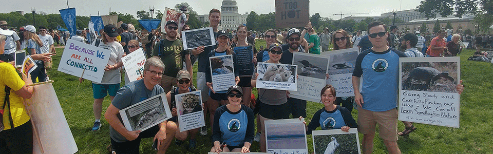 Group photo of National Wildlife Federation staff holding signs at the People's Climate March